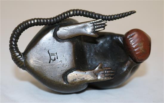 Two Japanese two-colour bronze models of a rat holding a nut, 19th century, length 9cm and 9.5cm